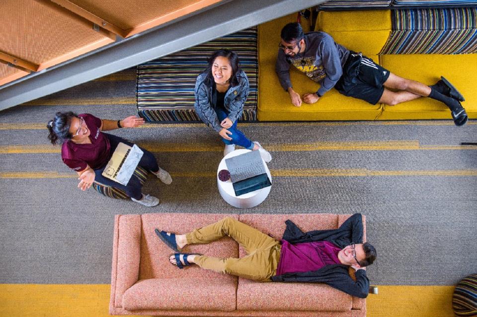 Photo of students collaborating in a lobby